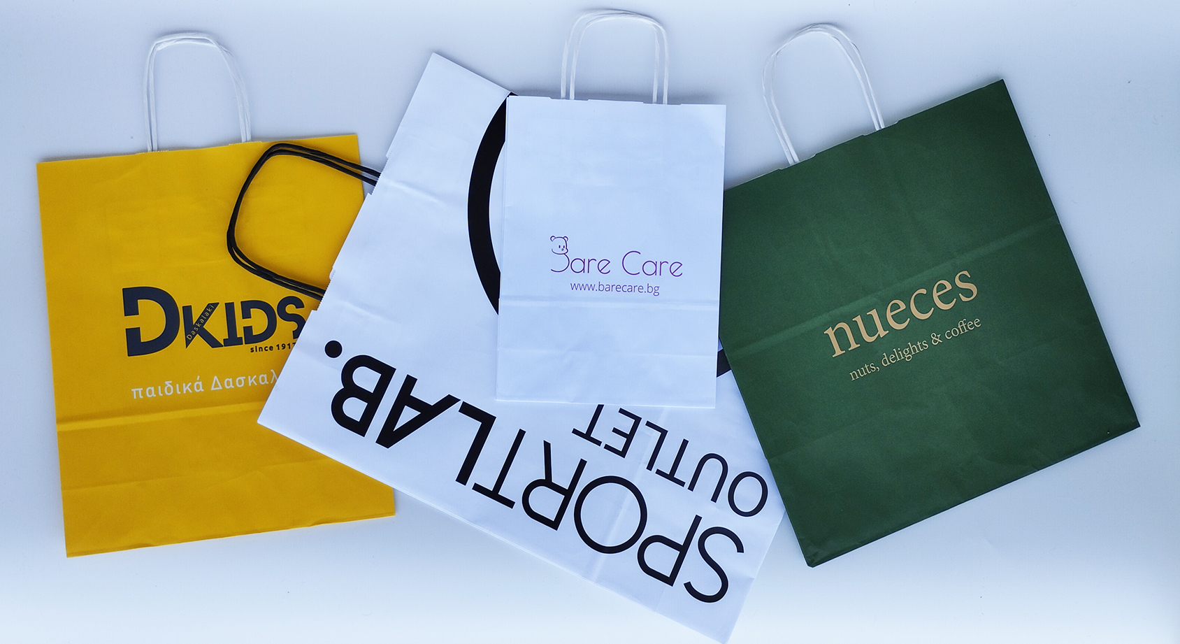 Τσάντες χάρτινες κραφτ με στριφτές και πλακέ λαβές